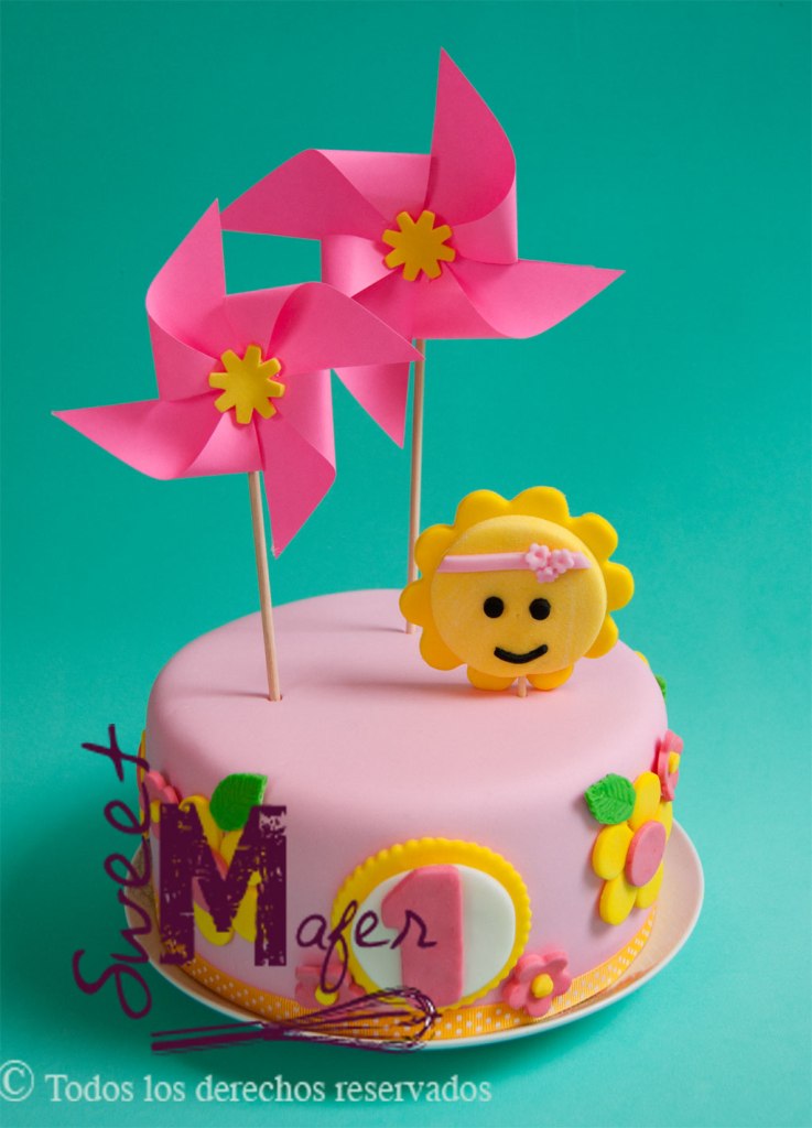 Torta primer año con sol flores y ringletes